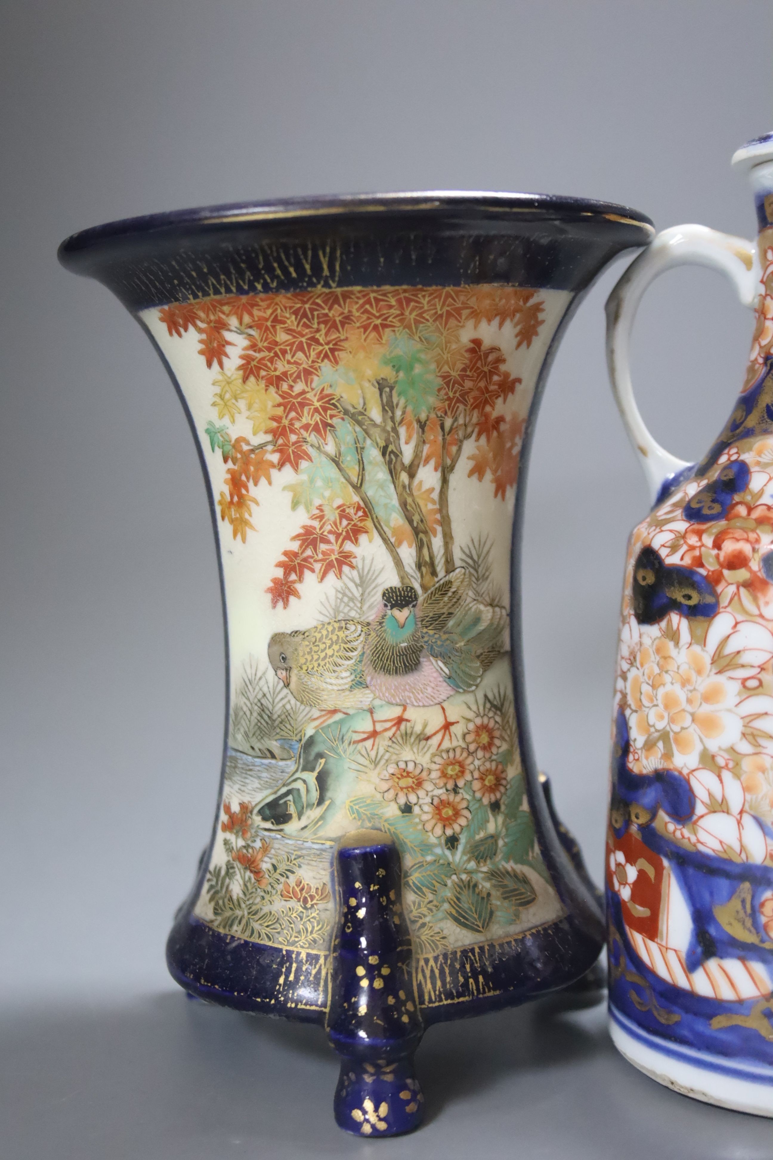 A Japanese Imari sake jug and a Satsuma pottery blue ground vase, tallest 18cm
